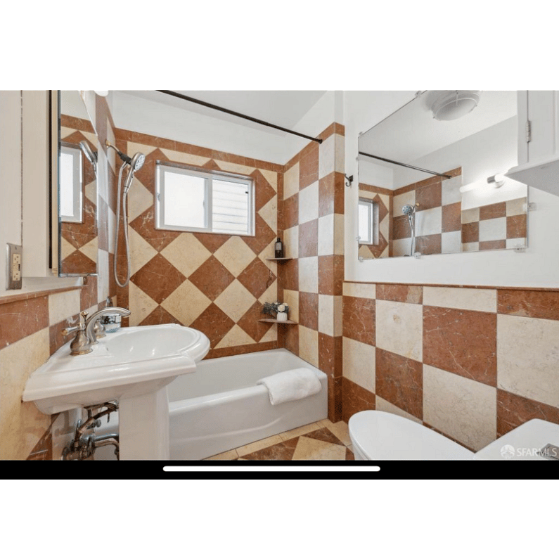 Full bathroom stocked with essentials, extra towels and hair dryer.