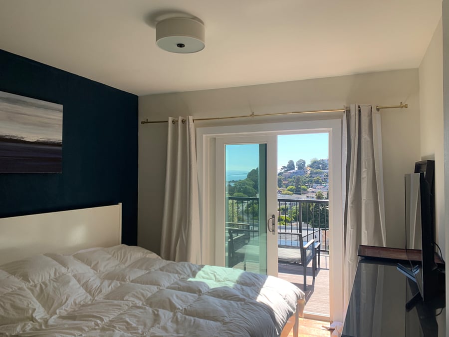 Bedroom # 2 opens to the front patio with bay views. This room has a kind bed and also a tv.