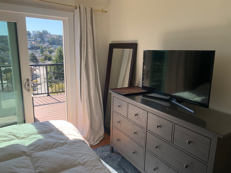 Bedroom # 2 opens to the front patio with bay views. This room has a kind bed and also a tv.
