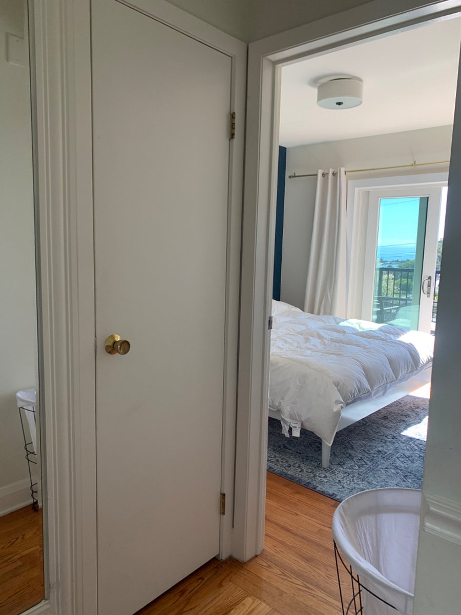 Bedroom # 2 opens to the front patio with bay views. This room has a kind bed and also a tv.