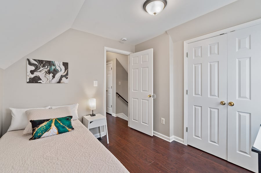 Upper level bedroom with twin bed and desk