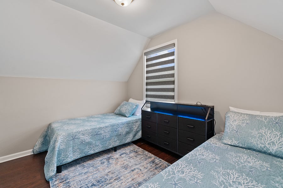 Upper level bedroom with twin beds