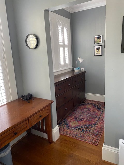 This is the full-sized dresser - directly across the closed, creating a "dressing' area. (The desk is no longer in the room - there is a full sized mirror in this corner)