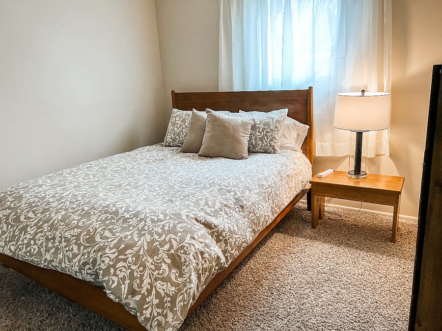 Queen bed in second bedroom upstairs