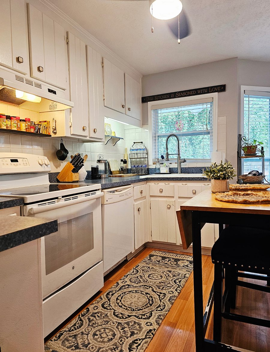 Kitchen with ample counter space with essential appliances included.
