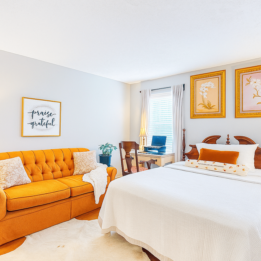 Spacious 2nd Bedroom filled with natural light comfortably accommodating a queen or king bed with additional seating space.