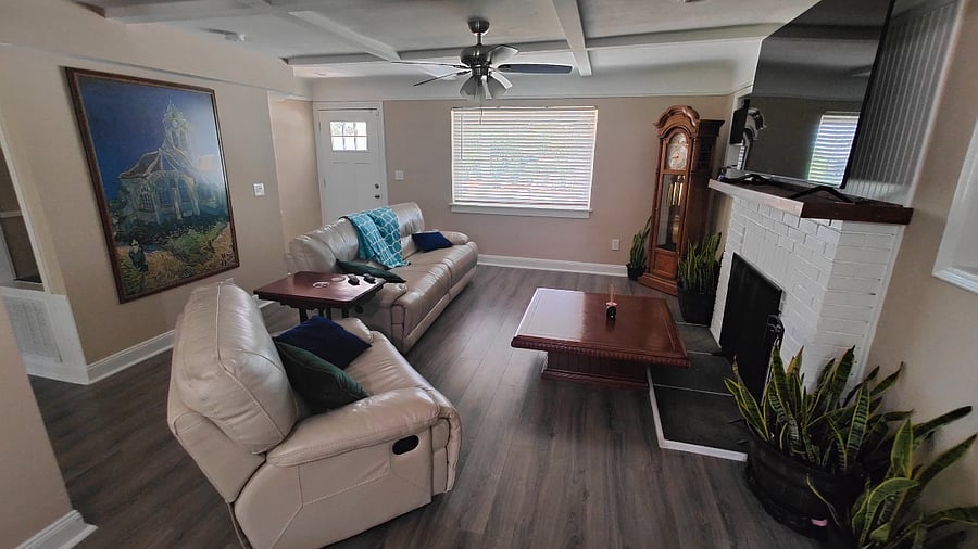 Living room with power recline leather sofa.
