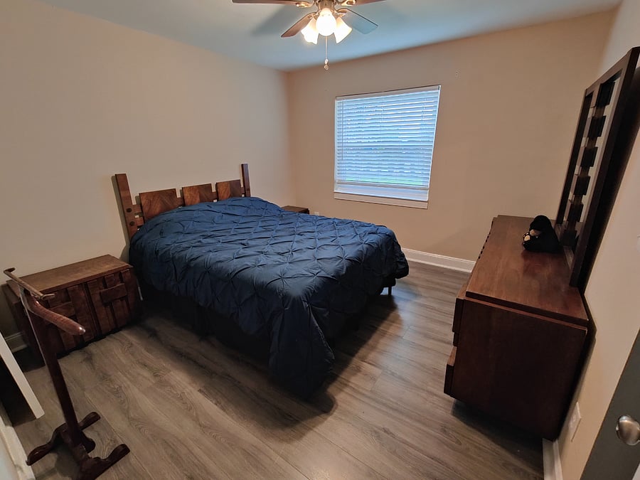 Bedroom one with queen sized bed. There is plenty of drawer space and a closet (not shown).