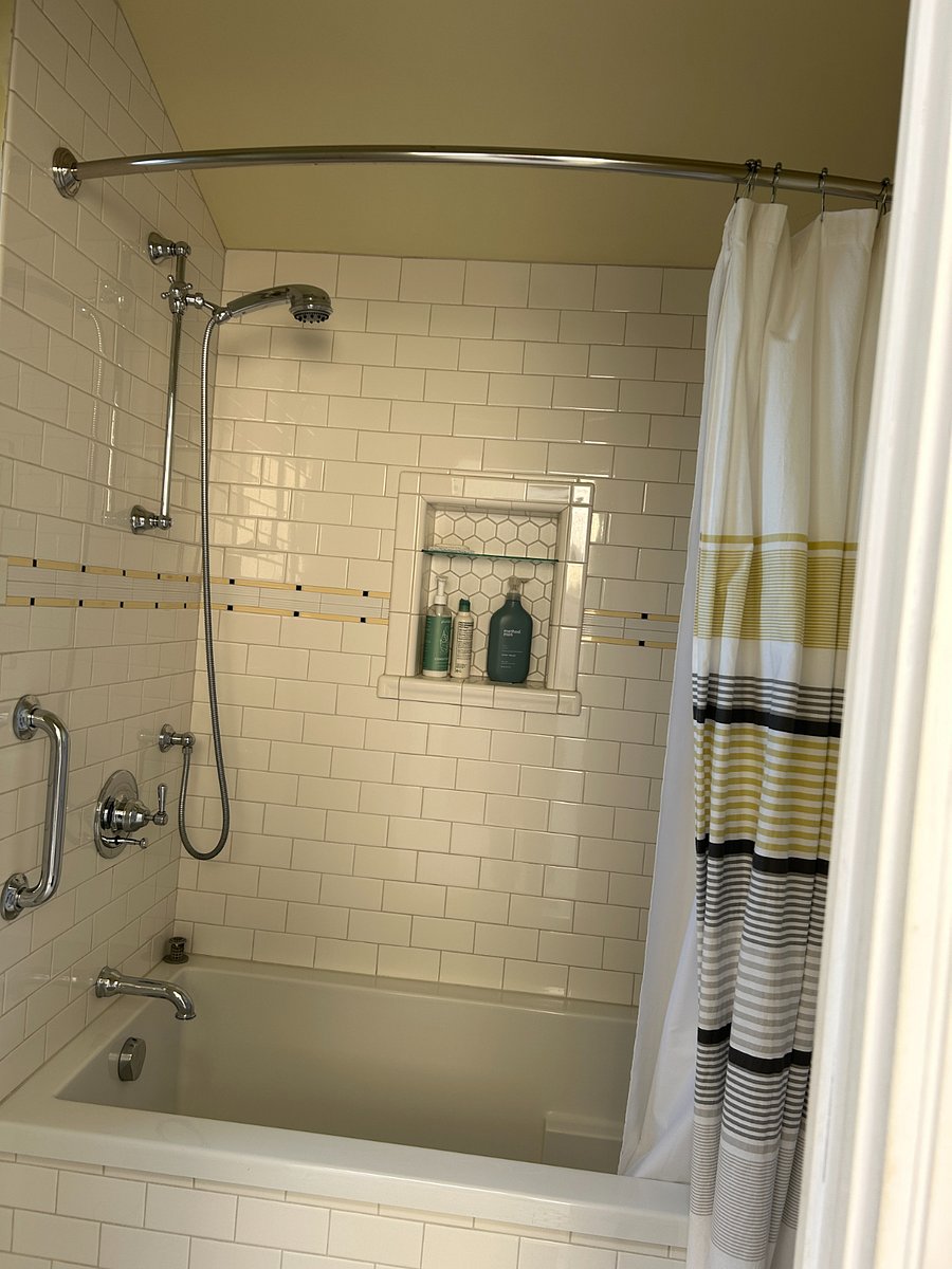 Beautiful tiled shower with soaker tub.