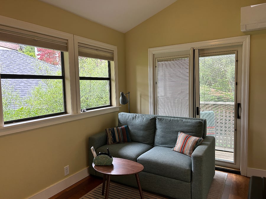 Sofa -- can convert to full sized bed for occasional guest.