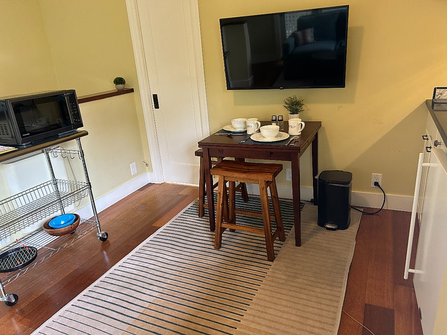 Table for two with leaves to expand for occasional guest. Smart TV with ROKU, Netflix, Prime and network TV.