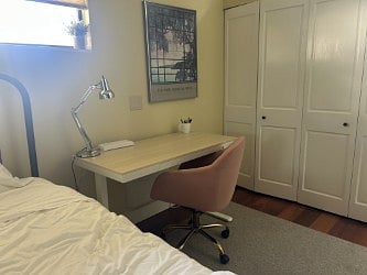 Work station with adjustable desk, excellent Wi-Fi, and comfortable chair.