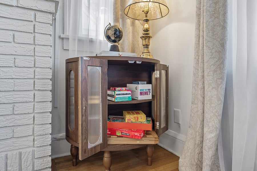 Weve stocked the living room cabinet with family games and toys for the kids to enjoy!