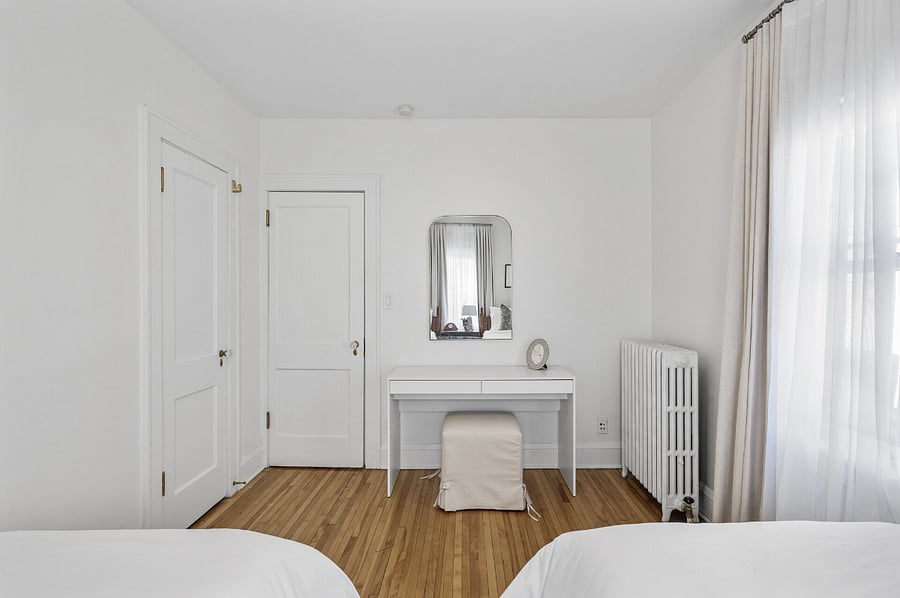 This versatile area can be used as either a makeup vanity or a convenient workspace during your stay.