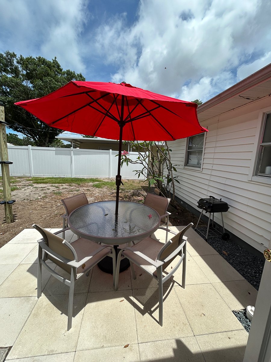 Outdoor seating with a grill.