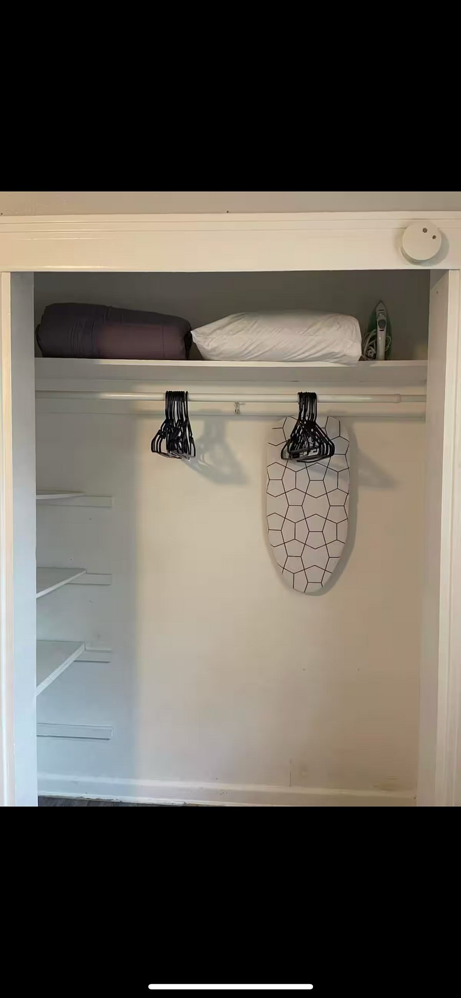 Iron and ironing board. Extra blankets and pillows.