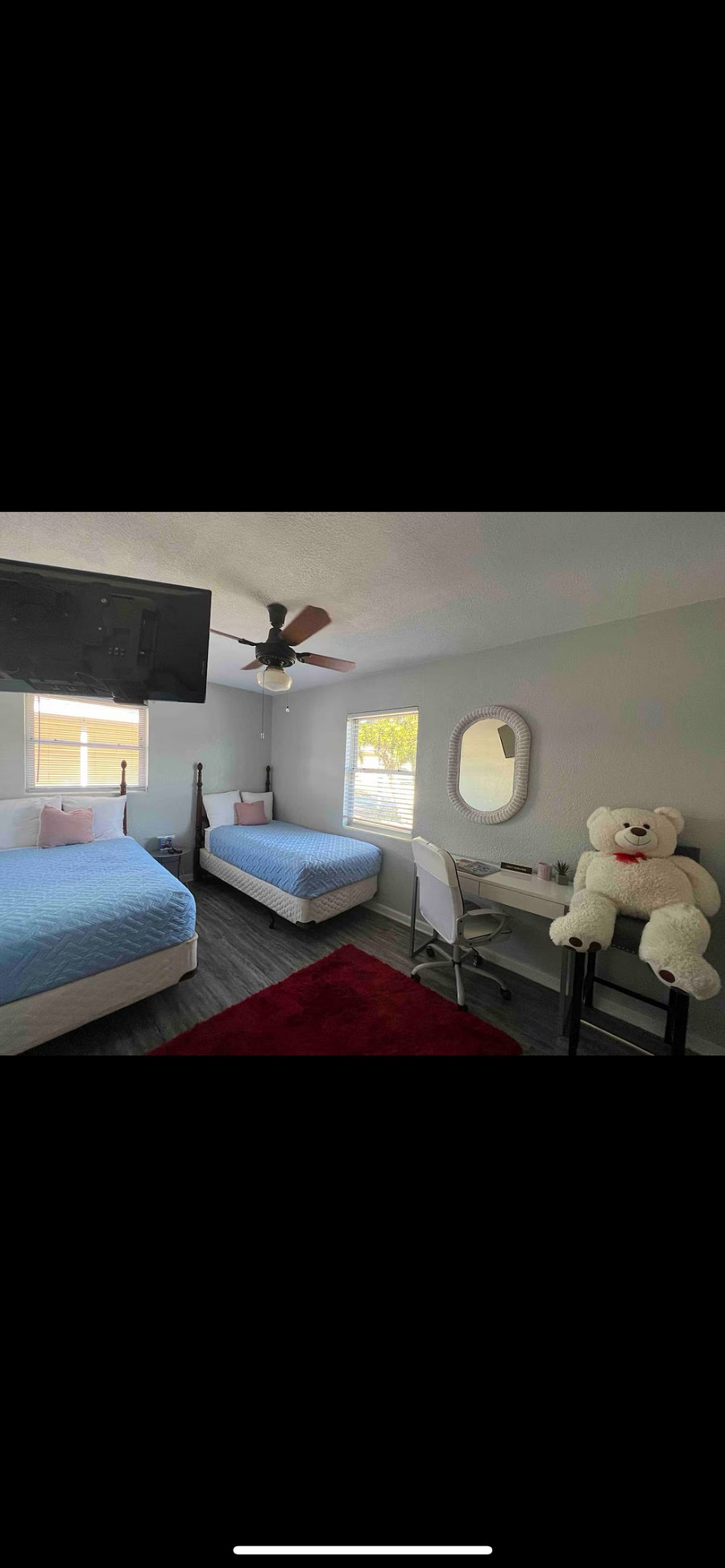 2nd bedroom offers 2 twin beds with Netflix. Work from home desk with a comfortable adjustable chair.