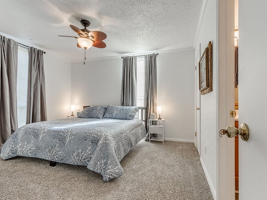 Santa Fe suite with locking door, en suite bath, desk, king size bed, (or twins) TV, chest of drawers, and walk-in closet.