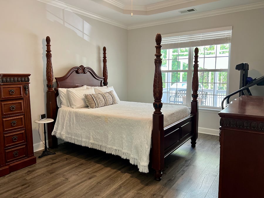 Master Bedroom, over looking rear porch with private bath & walk-in closet.