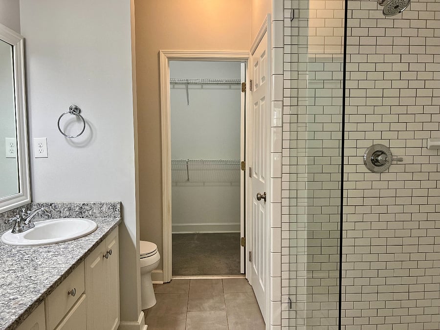 Master Bath with twin sinks, linen closet, and large walk-in shower.