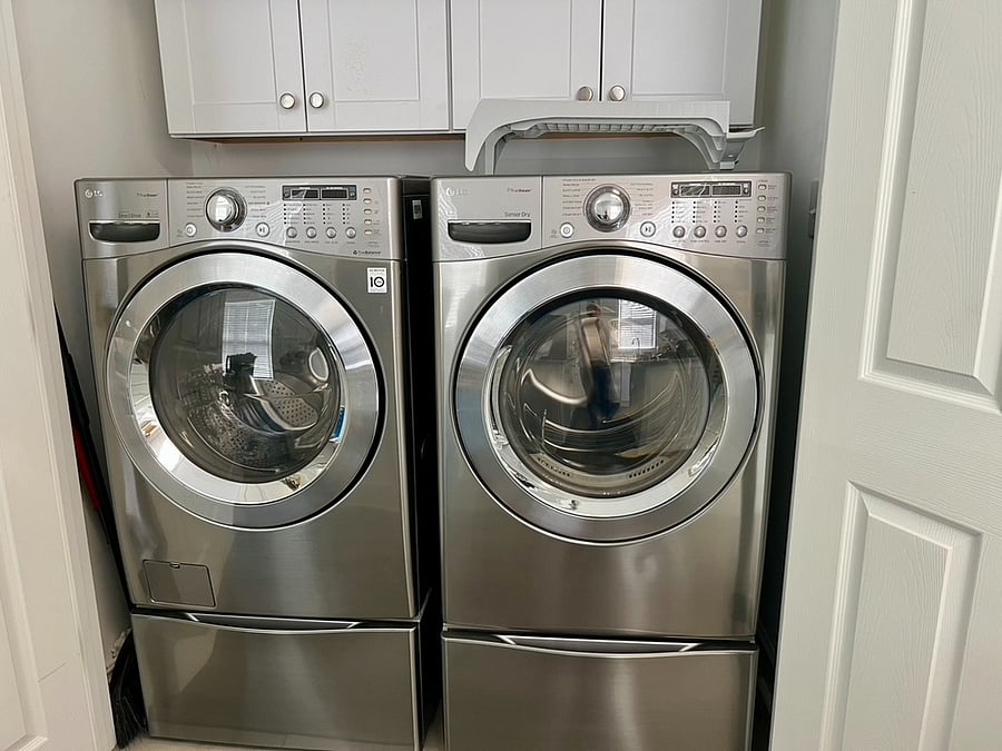 Washer & Dryer in double door closet off of the kitchen