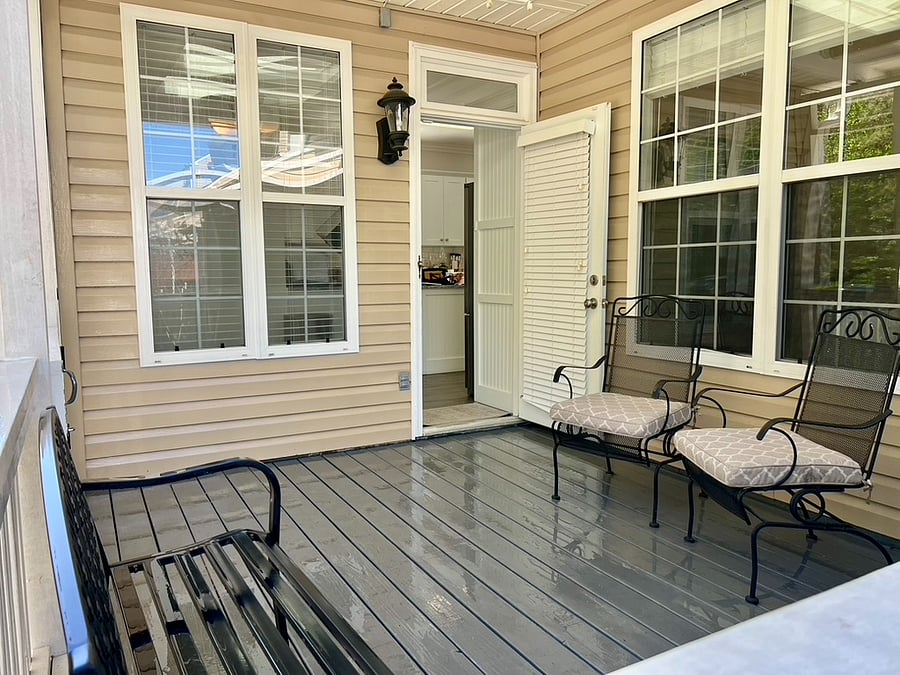 Rear covered porch with lights and fan.  Enters into the kitchen.