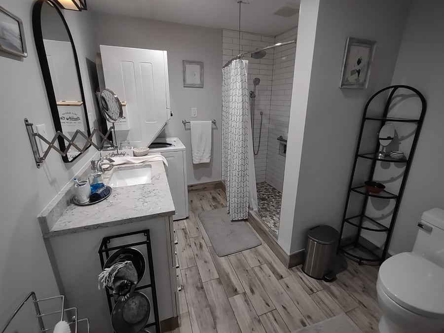 Eye care mirror, storage, large shower with 2 handrails.