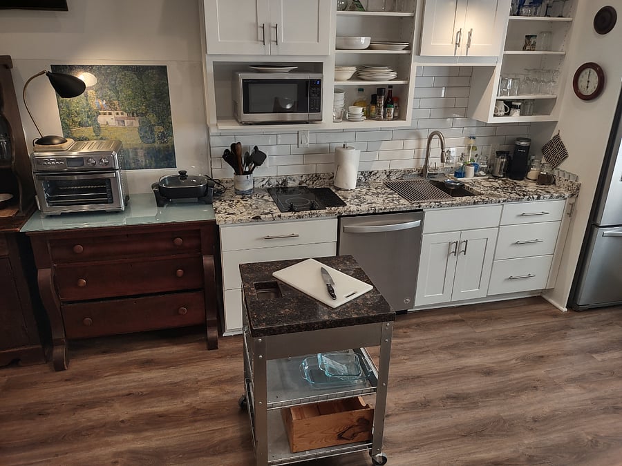 Movable prep island with granite counters top.