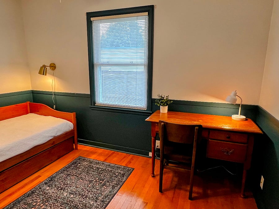 Work from home at a sturdy vintage desk with natural light. 