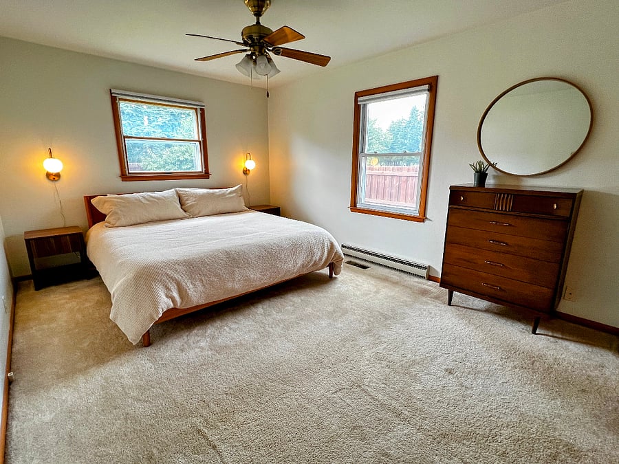 The primary bedroom is a serene retreat. It has a new Tuft & Needle king mattress and light blocking cellular shades.