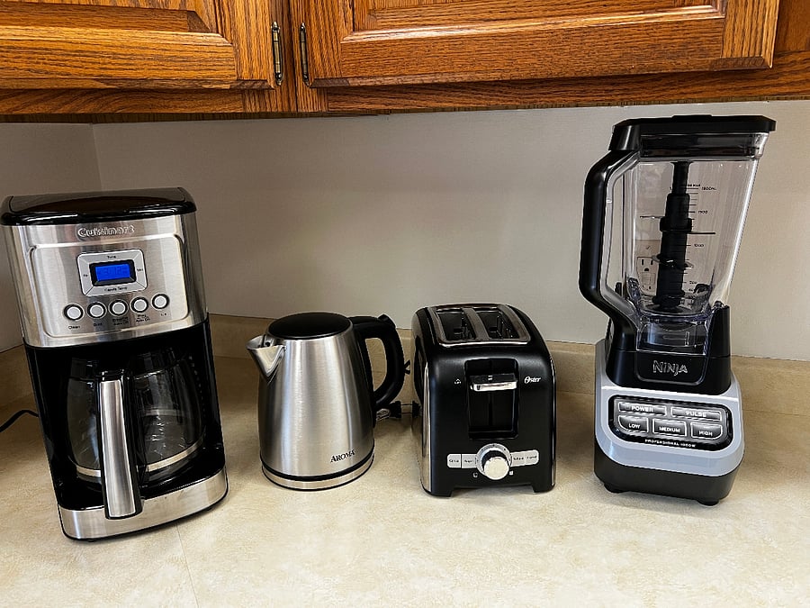 Brand new appliances include a coffee pot, electric kettle, toaster, and Ninja blender.