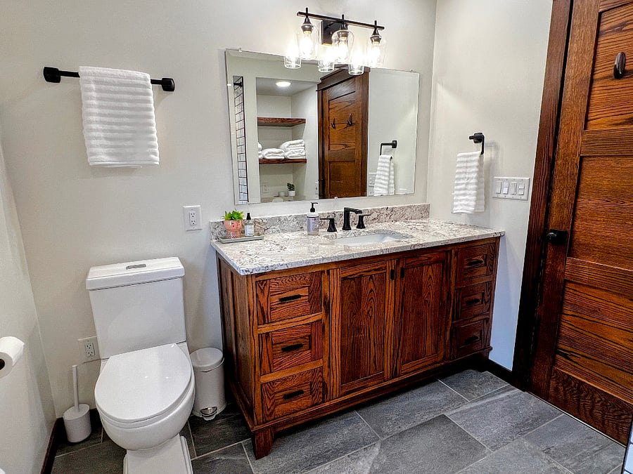 The bathroom has been completely updated has abundant storage.