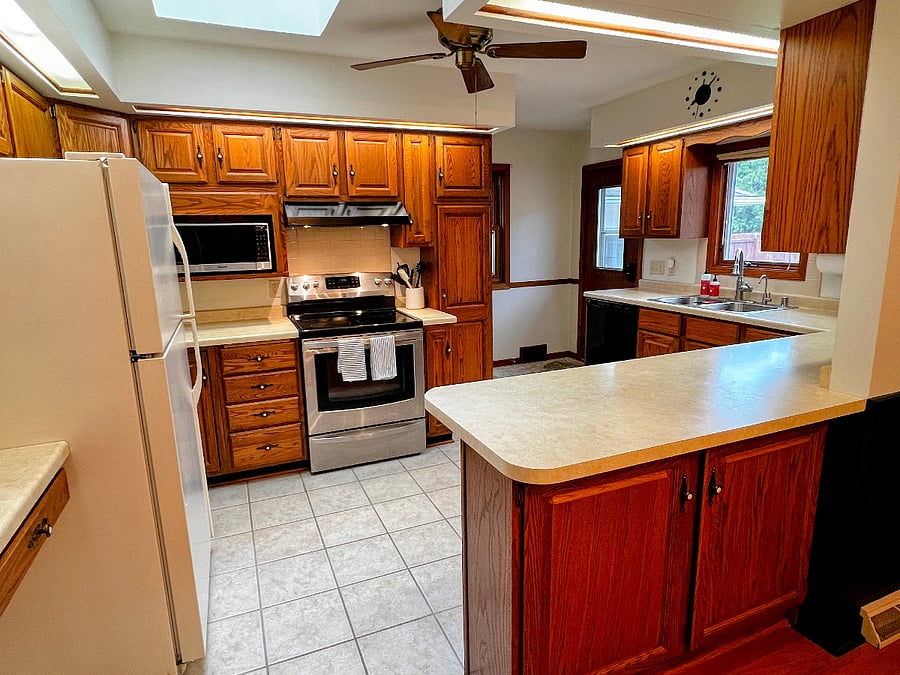 The kitchen is well-stocked for cooking and has ample storage.