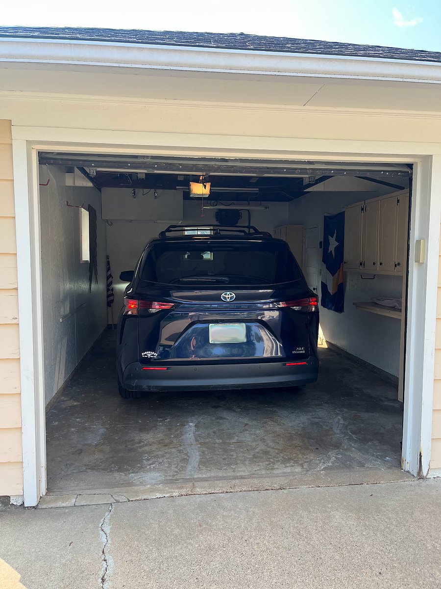 We fit our minivan in the garage. We flip in our driver side mirror to give ourselves a few more inches of room.