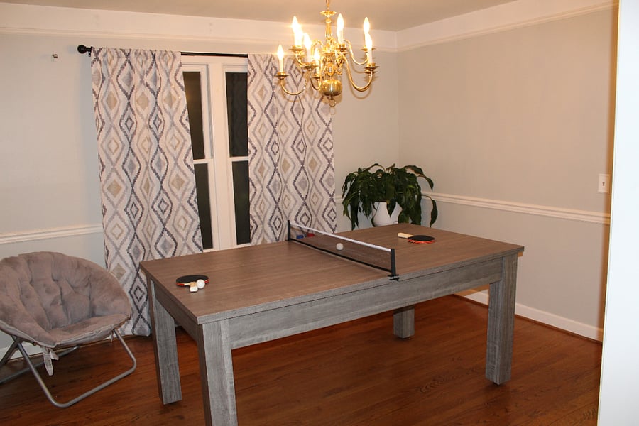 Game room with a ping pong table that converts to a pool table as well!