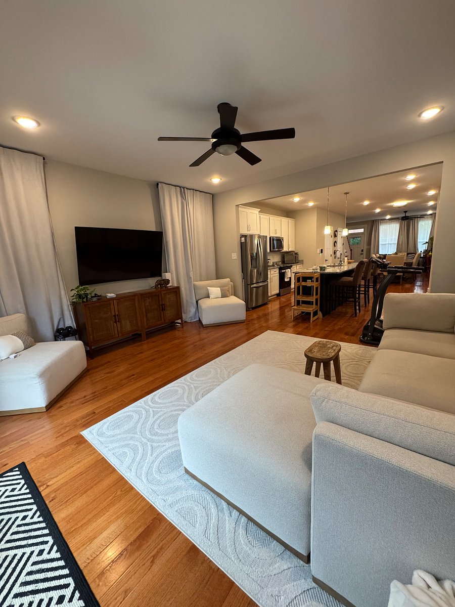 Living room featuring 65" curved TV