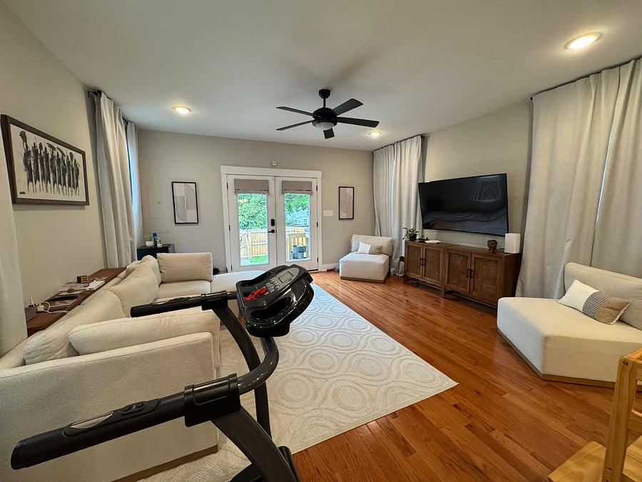 Living room with treadmill on side