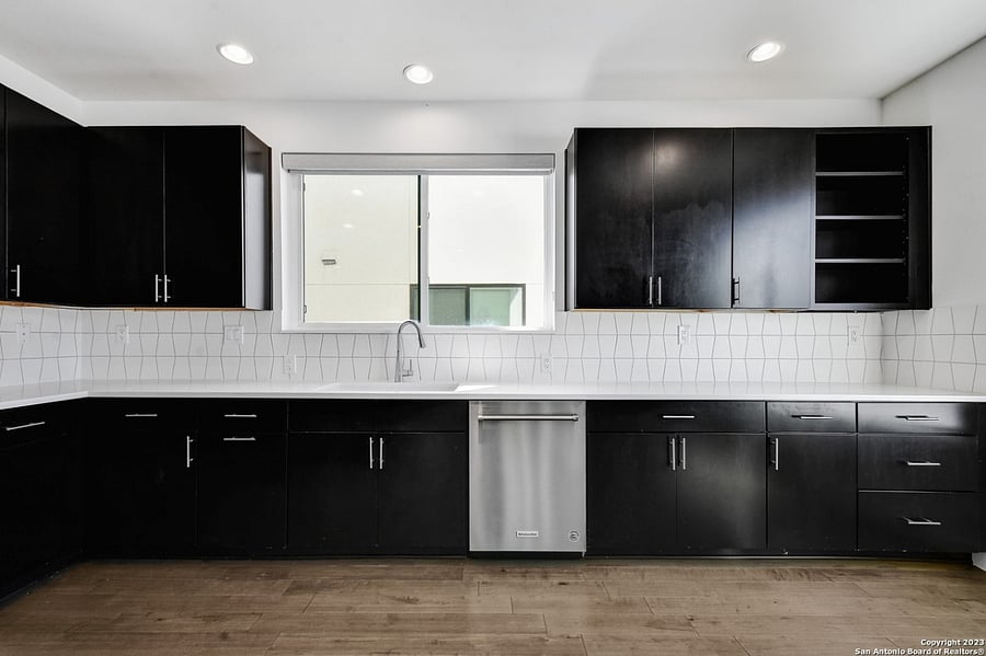 Kitchen with dishwasher, gas stove, refridgerator, and microwave