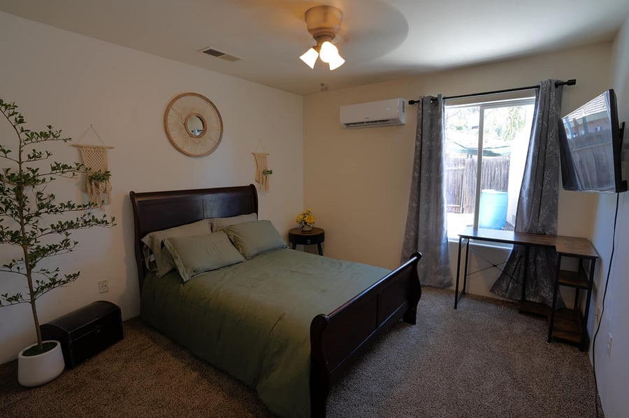 The green room has its own private restroom and is located in a separate wing. It has a full-size bed, desk, and walk-in closet. The room has digital locks with keys, fingerprints, or a mobile entrance.