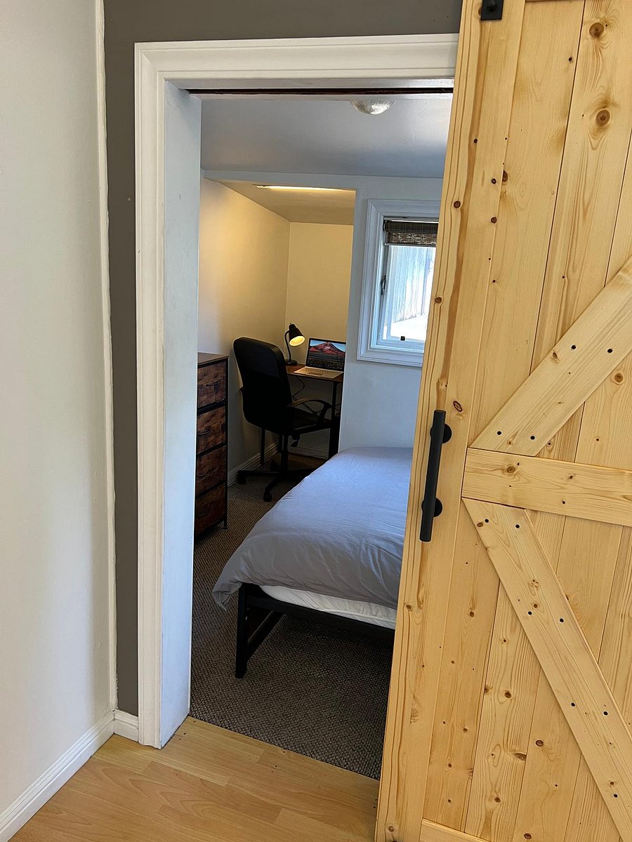 Sliding barn door opens into bedroom. 