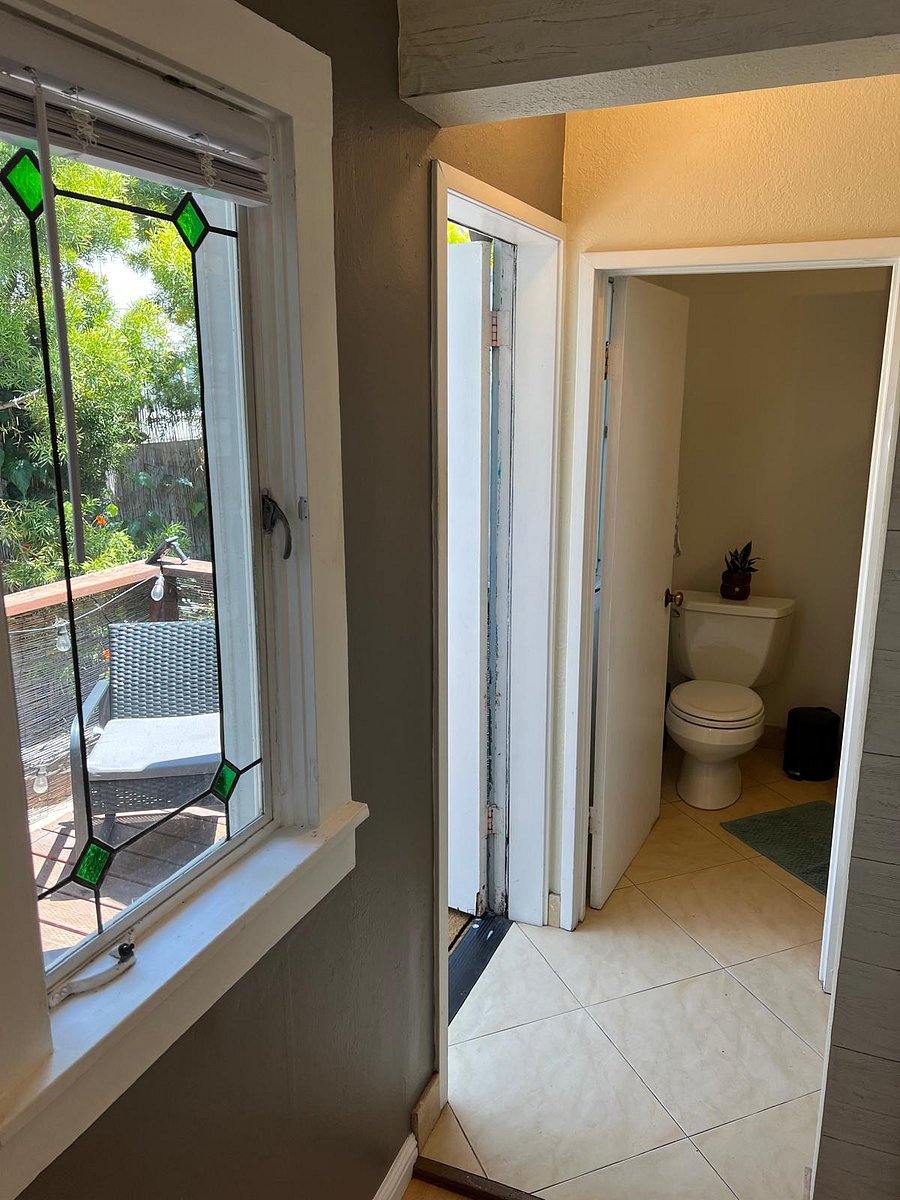 View from hallway to the back deck and bathroom. 
