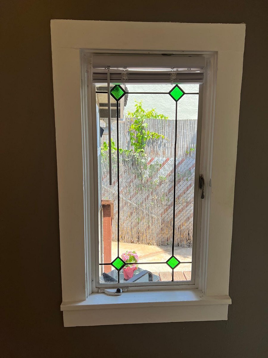 Beautiful stained glass window looking out onto the back deck. 