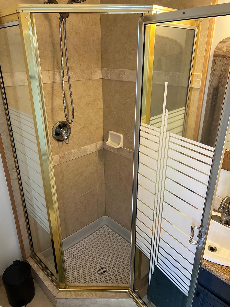 Shower with handheld showerhead.