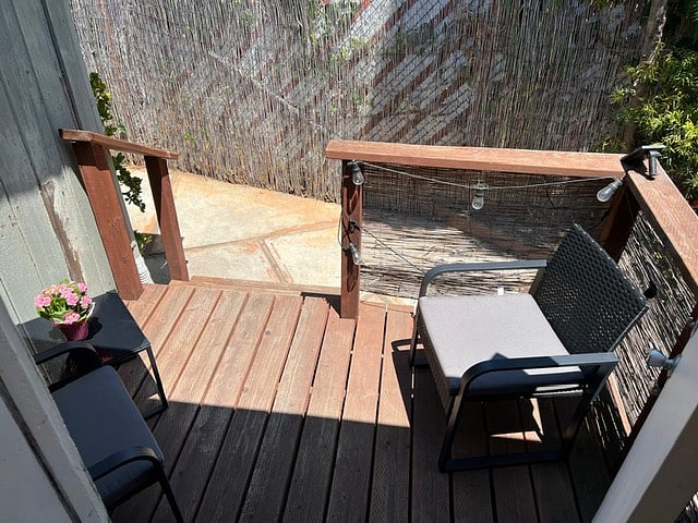 Back deck with lounge furniture.