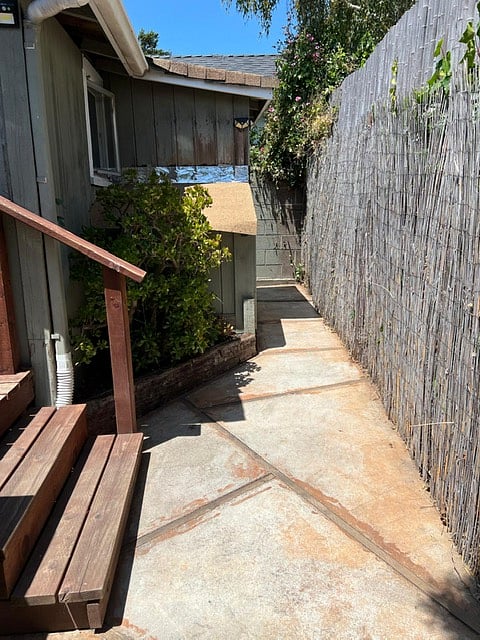 Path from back deck. Path is shared with one tenant in adjoining unit. 