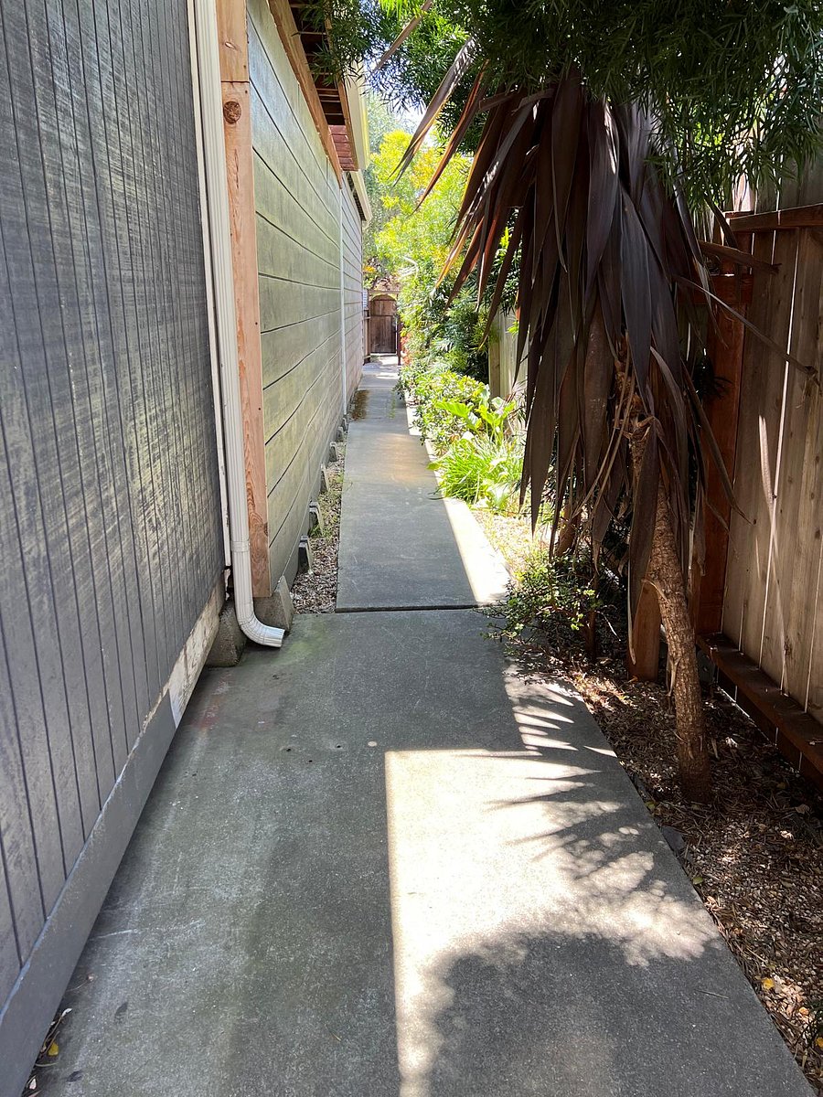 Private, secluded path from street to cottage. Cottage is located behind main house. 