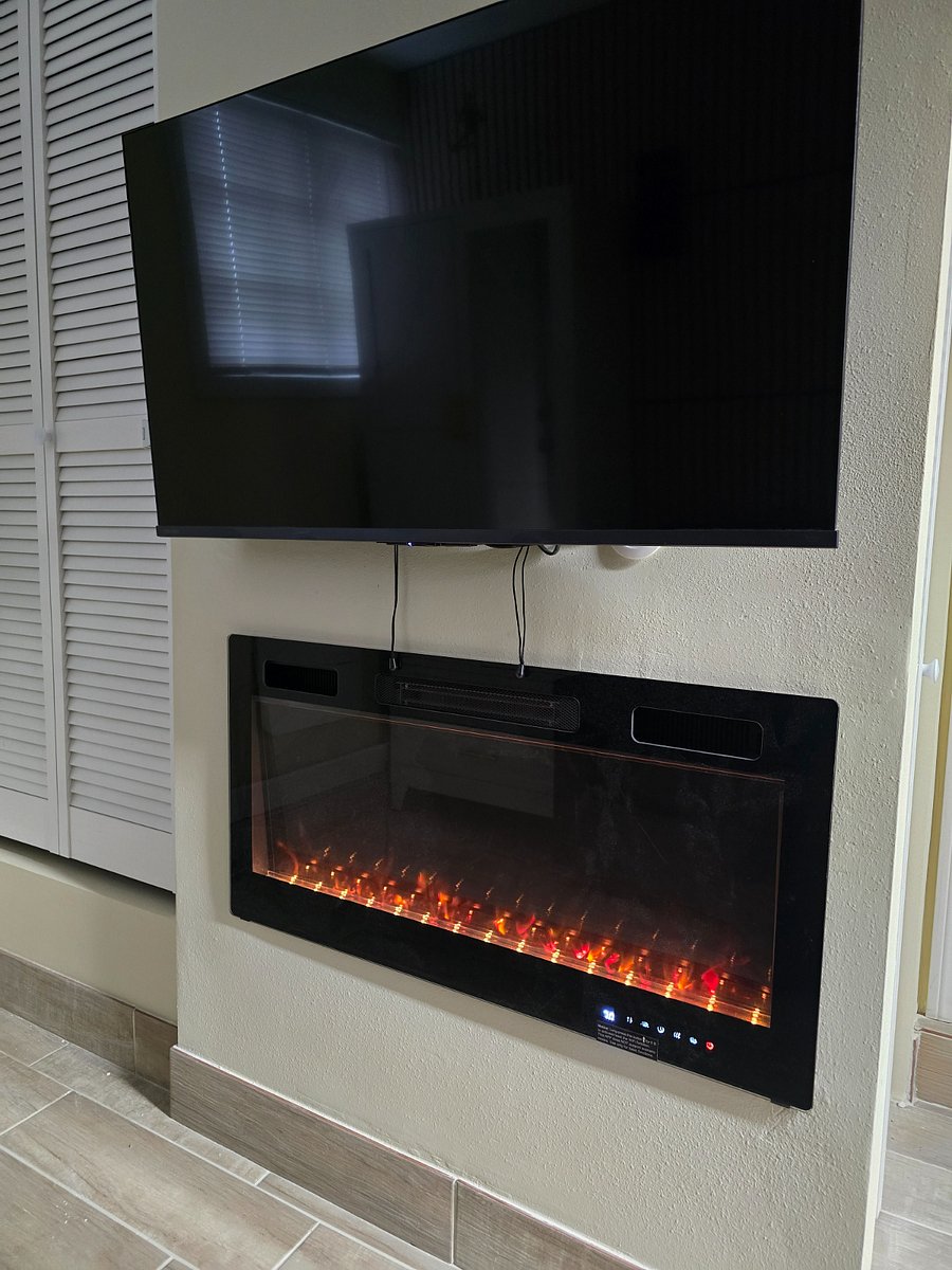 47 inch smart TV with an electric fireplace heater in the bonus room. 