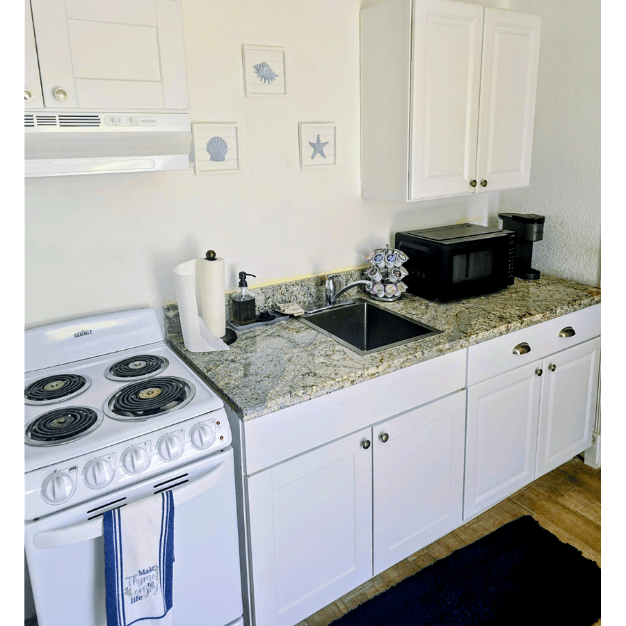 Fully equipped kitchen with coffee maker, stove, microwave and all utensils  needed to make most dishes. 