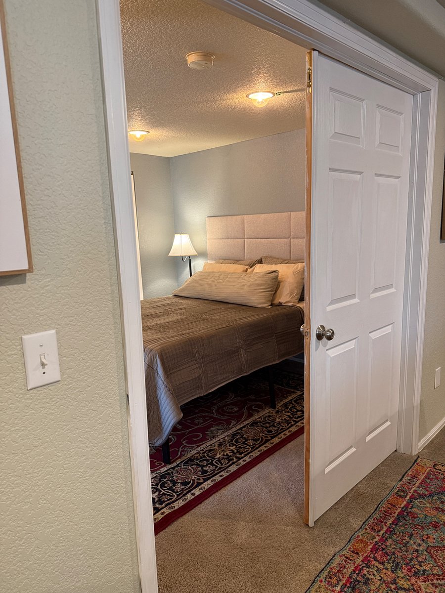 The second bedroom with a walk out slider to the yard