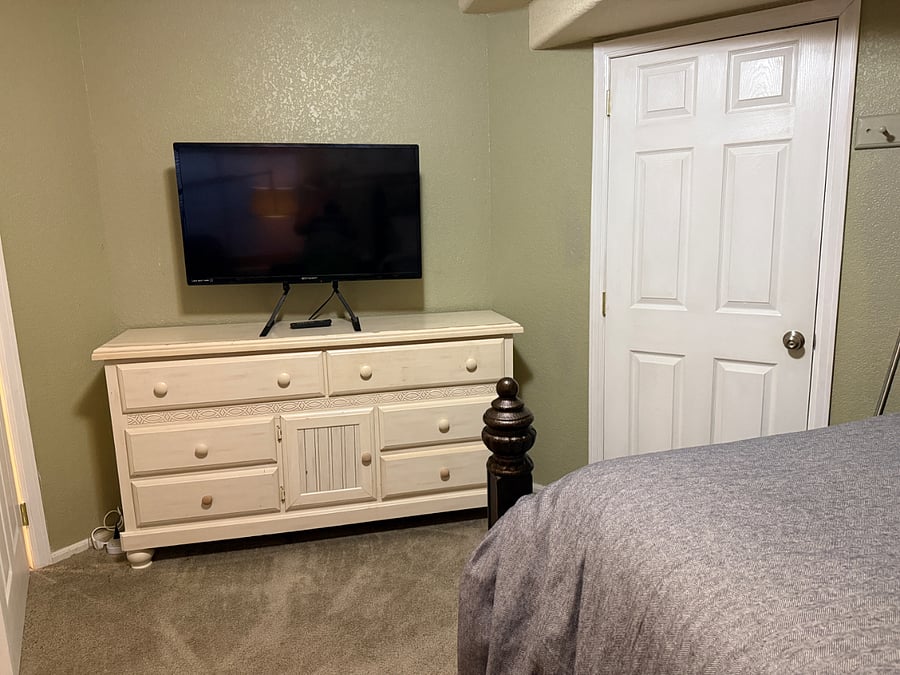 This is the primary bedroom "The Master" with a queen sized bed and direct bathroom access.